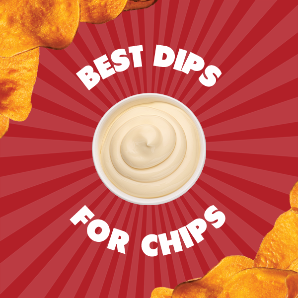 A colorful spread of chip dips including guacamole, queso, and pesto surrounded by crunchy chips for dipping
