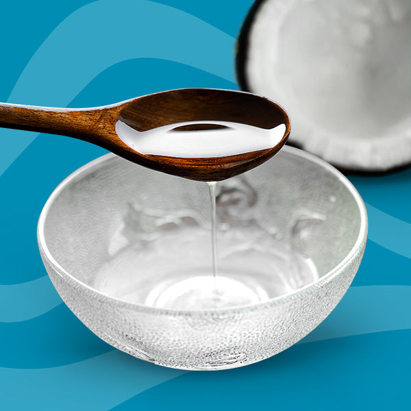 Spoon and bowl of coconut oil - what is cold pressed oil