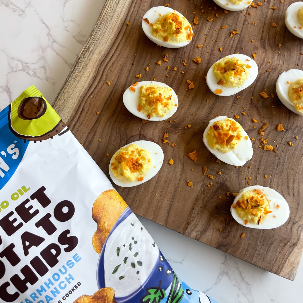 Deviled eggs with a bag of Jackson's Farmhouse Ranch Sweet Potato Chips next to them