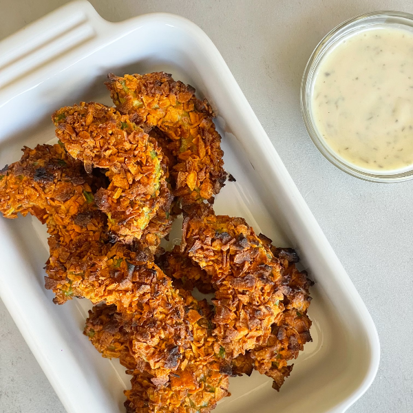 Avocado fries in dish with ranch dressing on the side.
