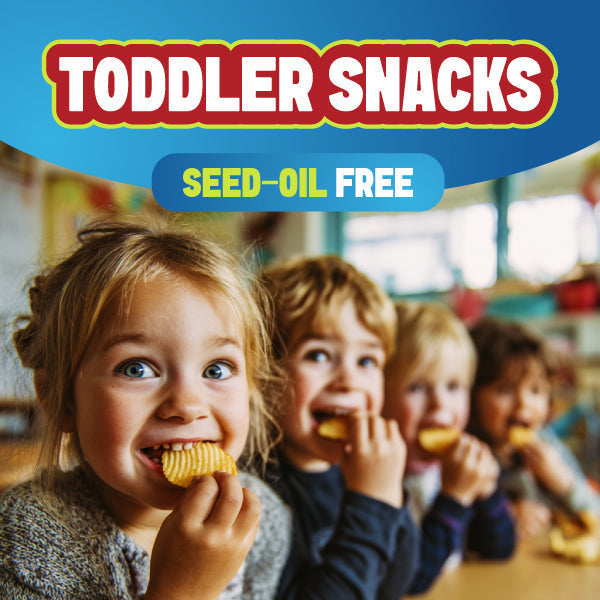 Toddler enjoying a snack made with avocado oil and other real ingredients