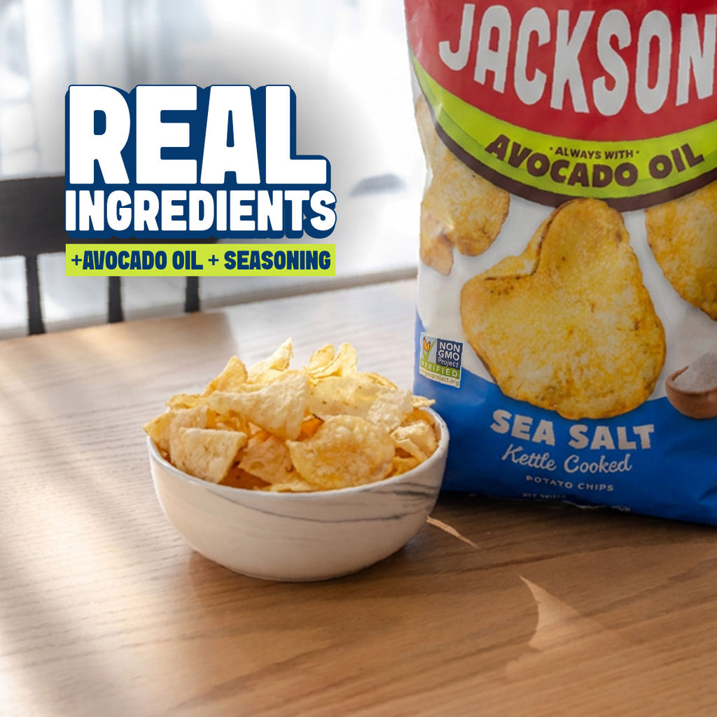 Jackson's Kettle Chips on a table with a bowl of chips and the text real ingredients + avocado oil + seasoning