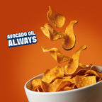 Crispy golden potato chips floating above a white bowl, with the text 'AVOCADO OIL ALWAYS' on a bright orange background.
