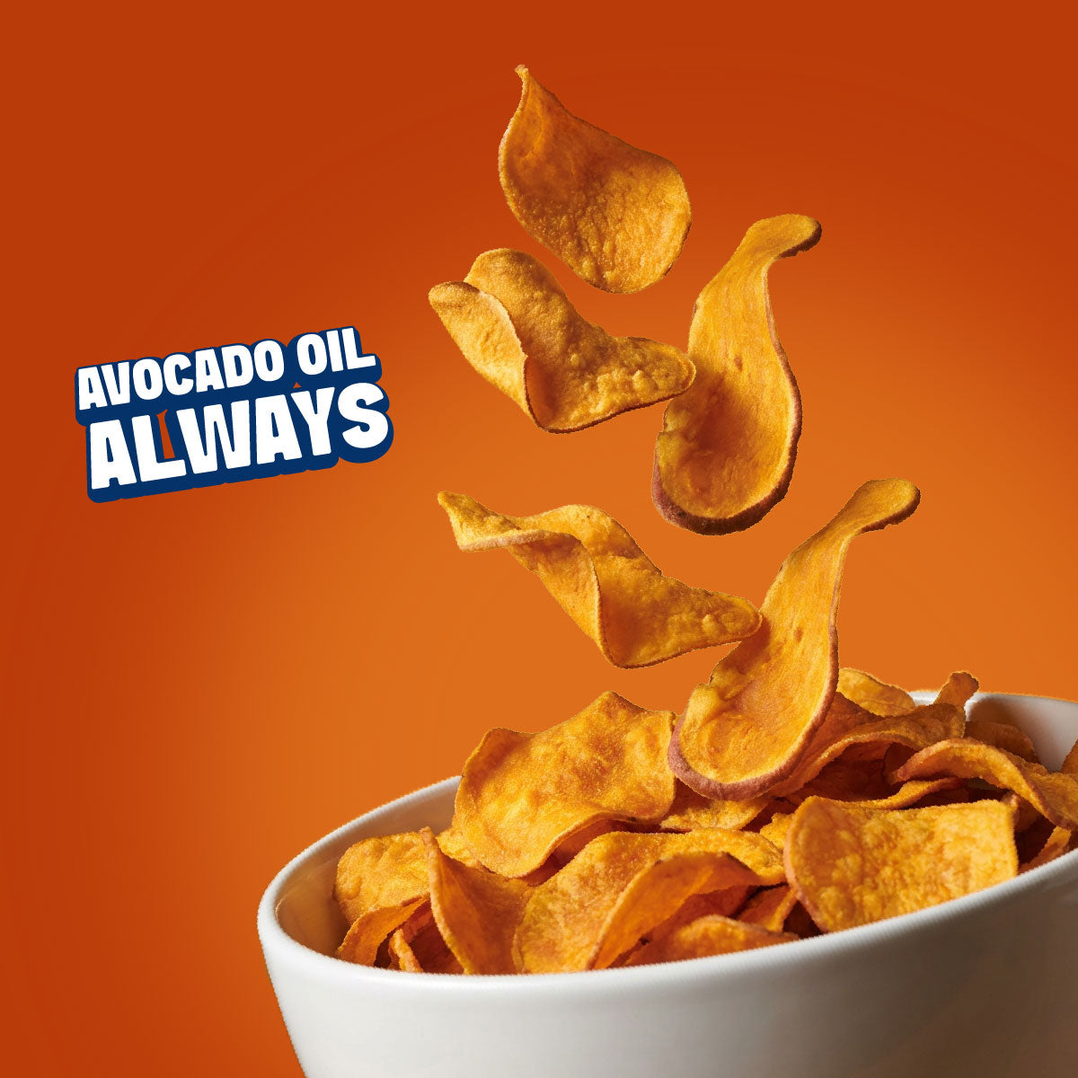 Crispy golden potato chips floating above a white bowl, with the text 'AVOCADO OIL ALWAYS' on a bright orange background.