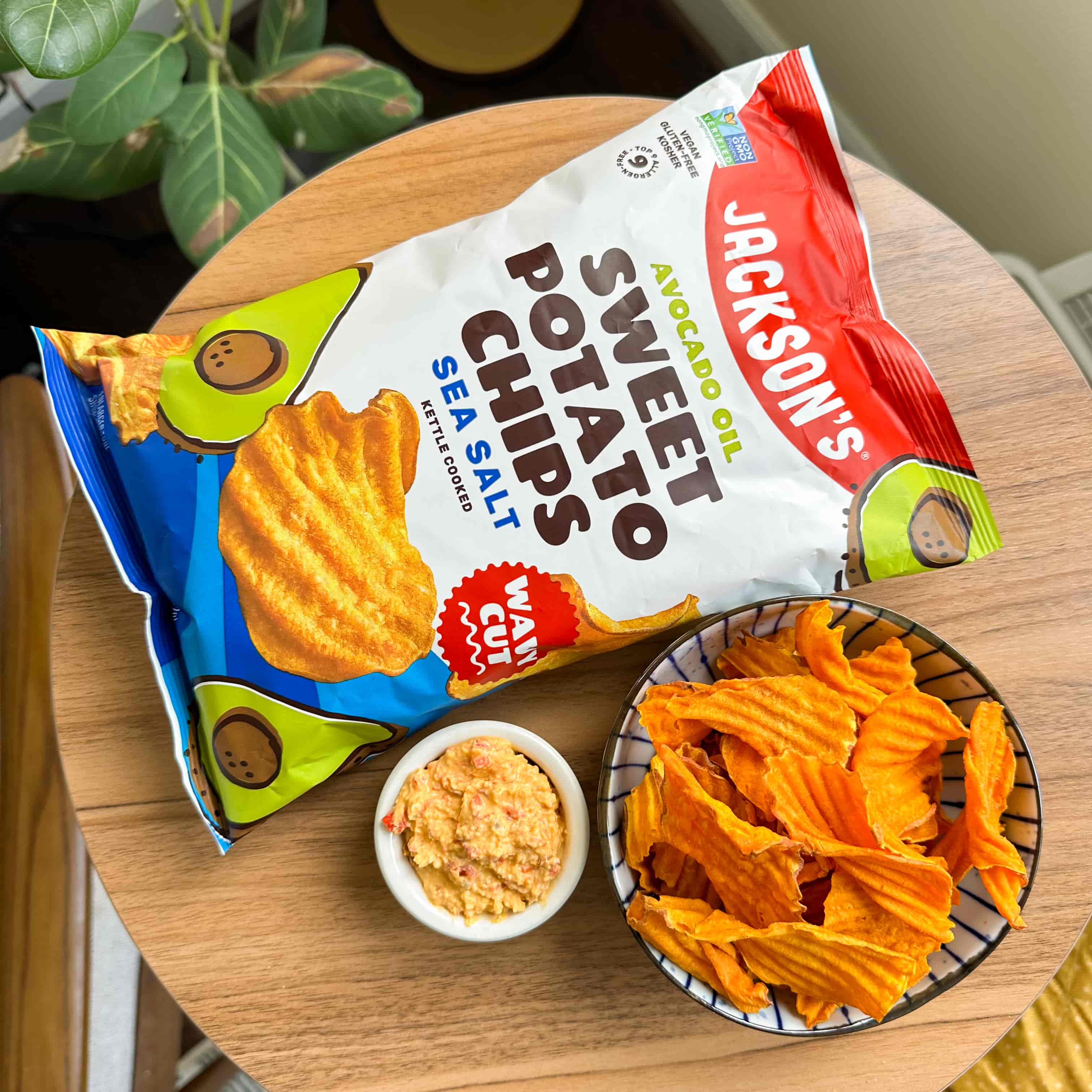 Jackson's Wavy Sea Salt Sweet Potato Chips kettle cooked in avocado oil on a table with dip
