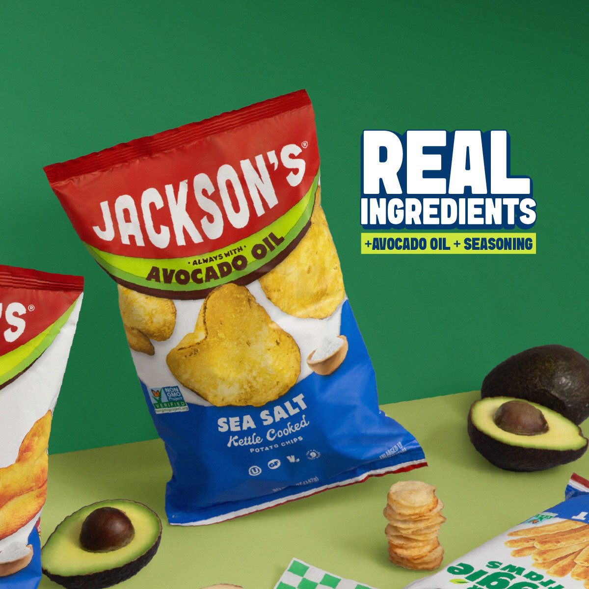 A bag of Jackson's Sea Salt Kettle Cooked Potato Chips is shown on a green tabletop with avocados and chips as props, alongside text reading 'REAL INGREDIENTS +AVOCADO OIL +SEASONING'.