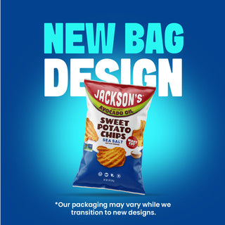 A bag of Jackson's Sweet Potato Chips Sea Salt is shown against a blue gradient background with large text reading 'NEW BAG DESIGN' and smaller disclaimer text at the bottom.